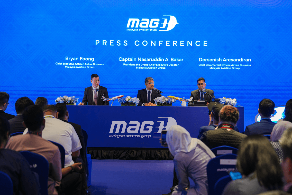  Malaysia Aviation Group (MAG) press conference, panel and audience with blue branding